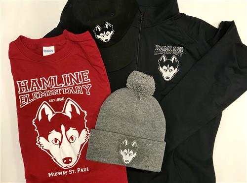 A photo showing red and black clothing featuring a white husky dog logo.