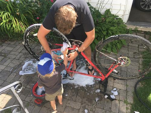 My son helping me with my bike 