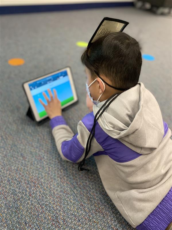 A 4th Grader playing an ST Math objective on his iPad.