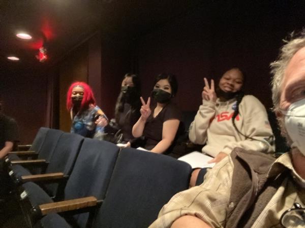 students in theater seats